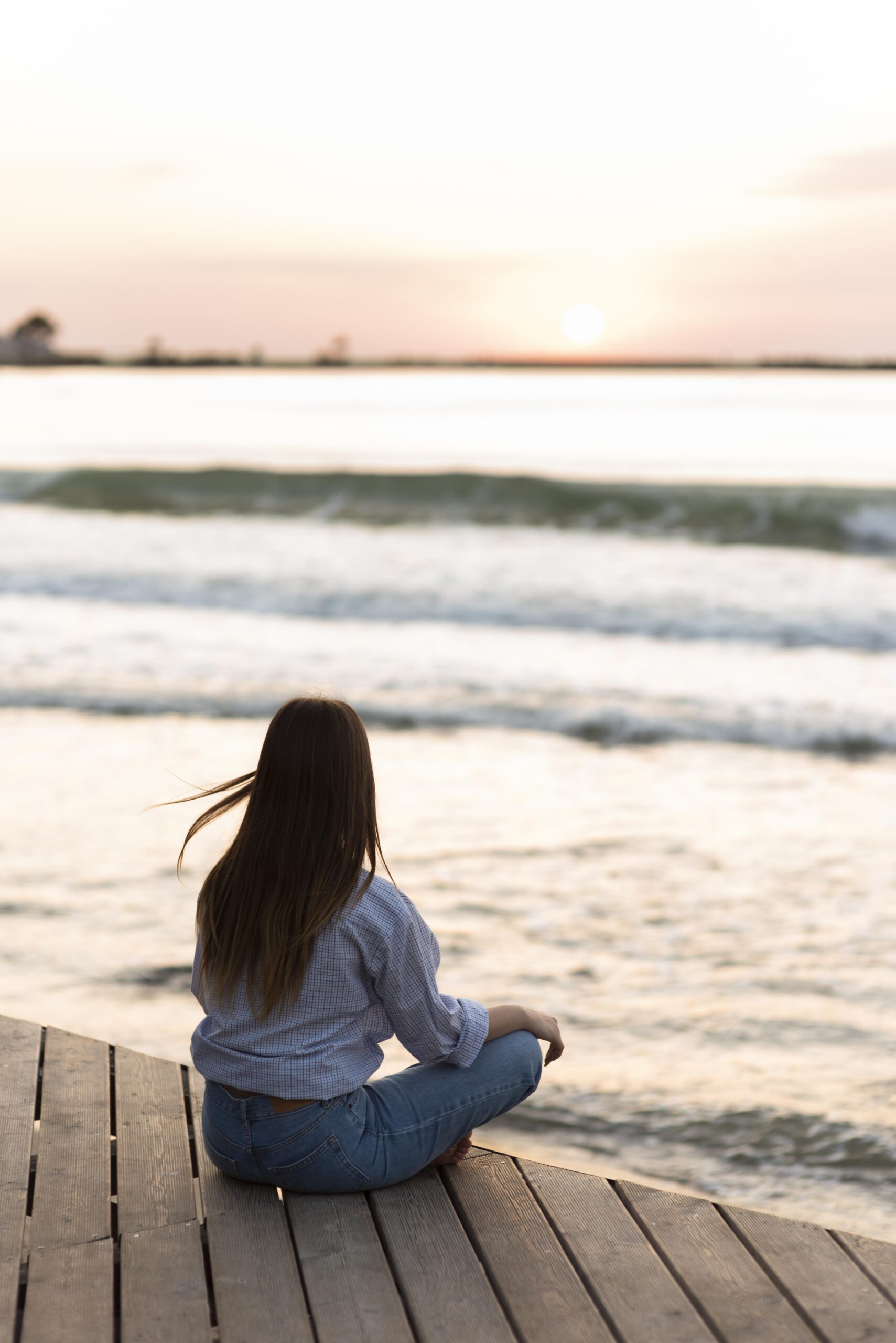 back-view-woman-meditating-outdoors